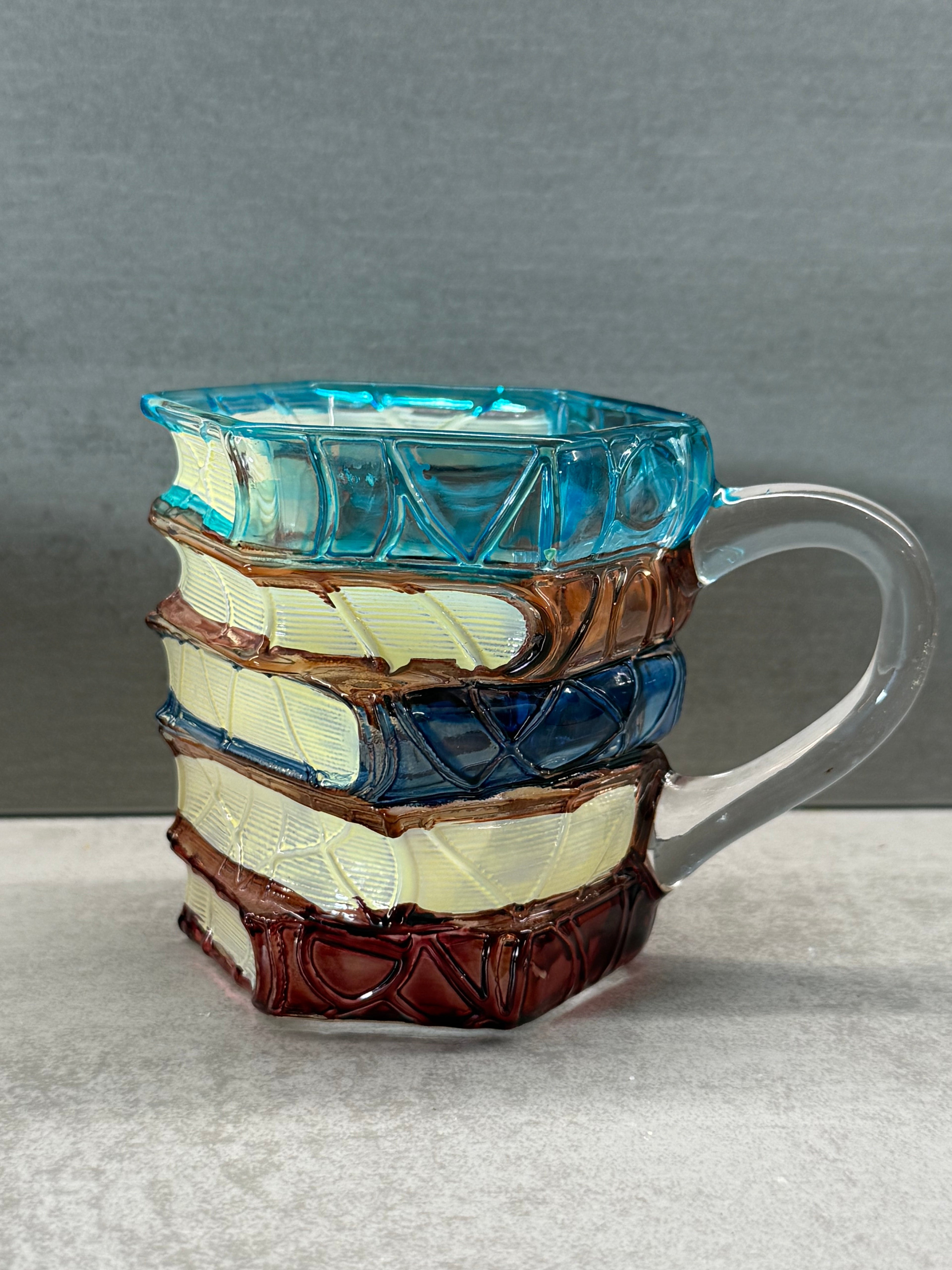 Multicolored glass object on a gray background