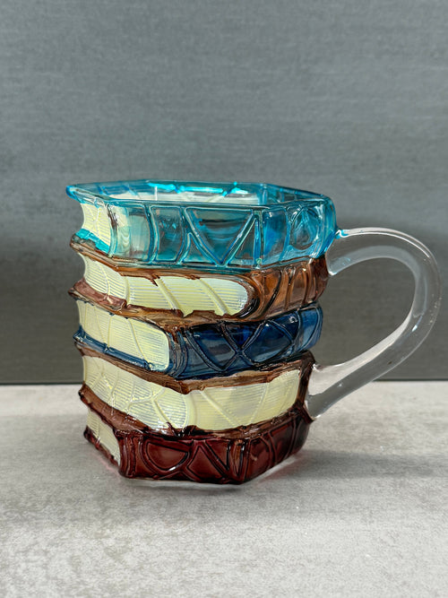 Multicolored glass object on a gray background